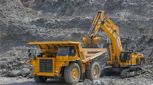 Hired Dump truck being loaded with ore on a construction site